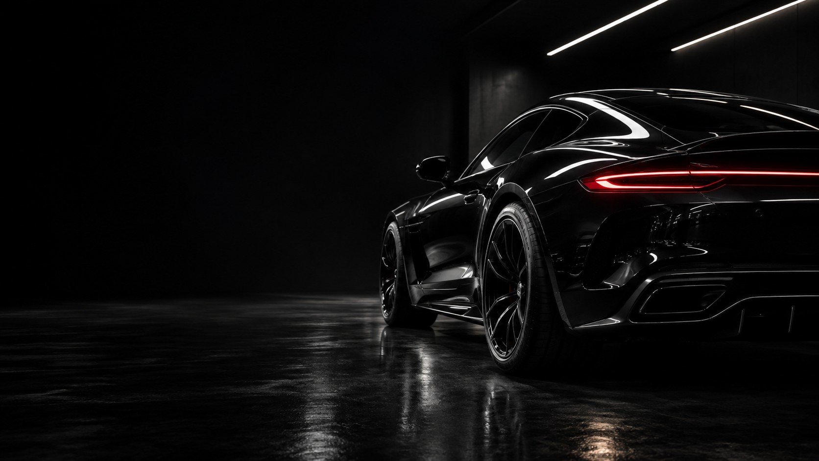 Black sports car with a mirror-gloss shine after a premium detail